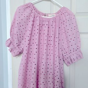 Light pink eyelet top with ruffled sleeves. Cute and cool for spring/summer